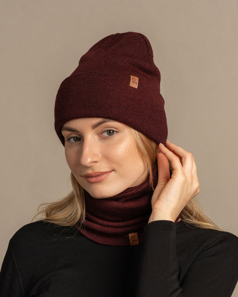 Woman wearing royal cherry knitted merino wool beanie and gaiter