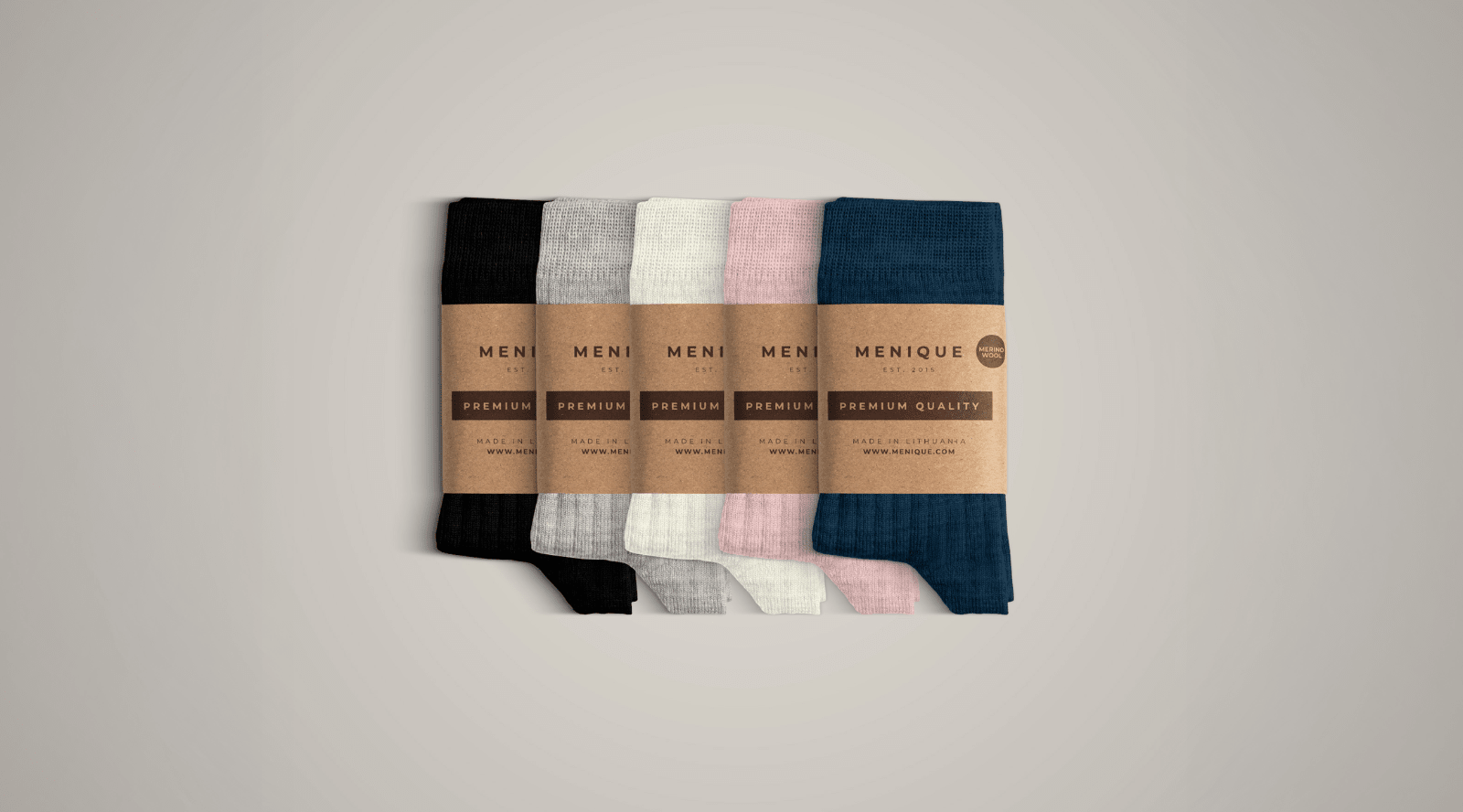 In this photo you can see rolled four pairs of socks, which are made from a mix of delicate Merino wool and cashmere. Candy pink, dark gray, creamy beige, and dusty pink tube socks.