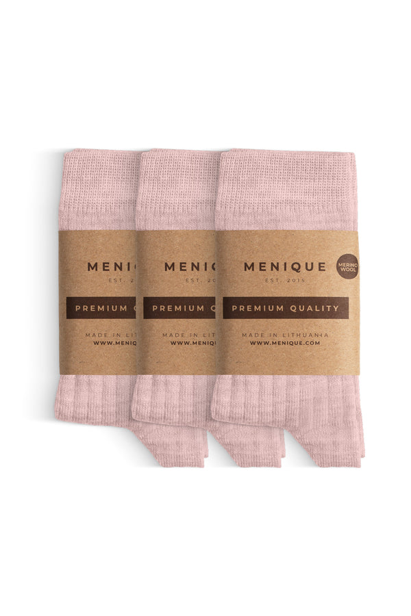 Een 3-pack lichtroze geribbelde merinowollen sokken voor kinderen met het label "Menique Premium Kwaliteit".