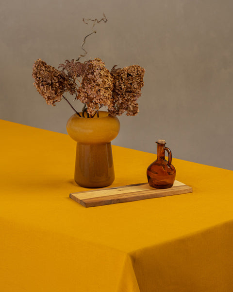 100% Linen Tablecloth in the color spicy yellow