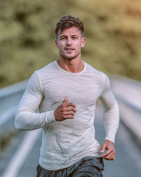 Man running outdoors on a blurred natural background