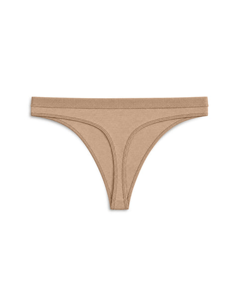 Product display of beige or nude thong-style underwear with visible seam detailing against a white background.