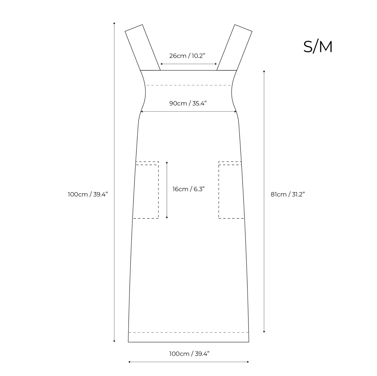 A woman with long red hair wearing a natural color linen apron, standing in a lush green garden and holding a woven basket.
